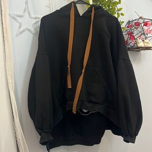 Black hoodie with a teddy bear on the back